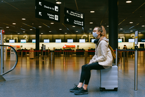 woman-sitting-on-luggage-3943882.jpg